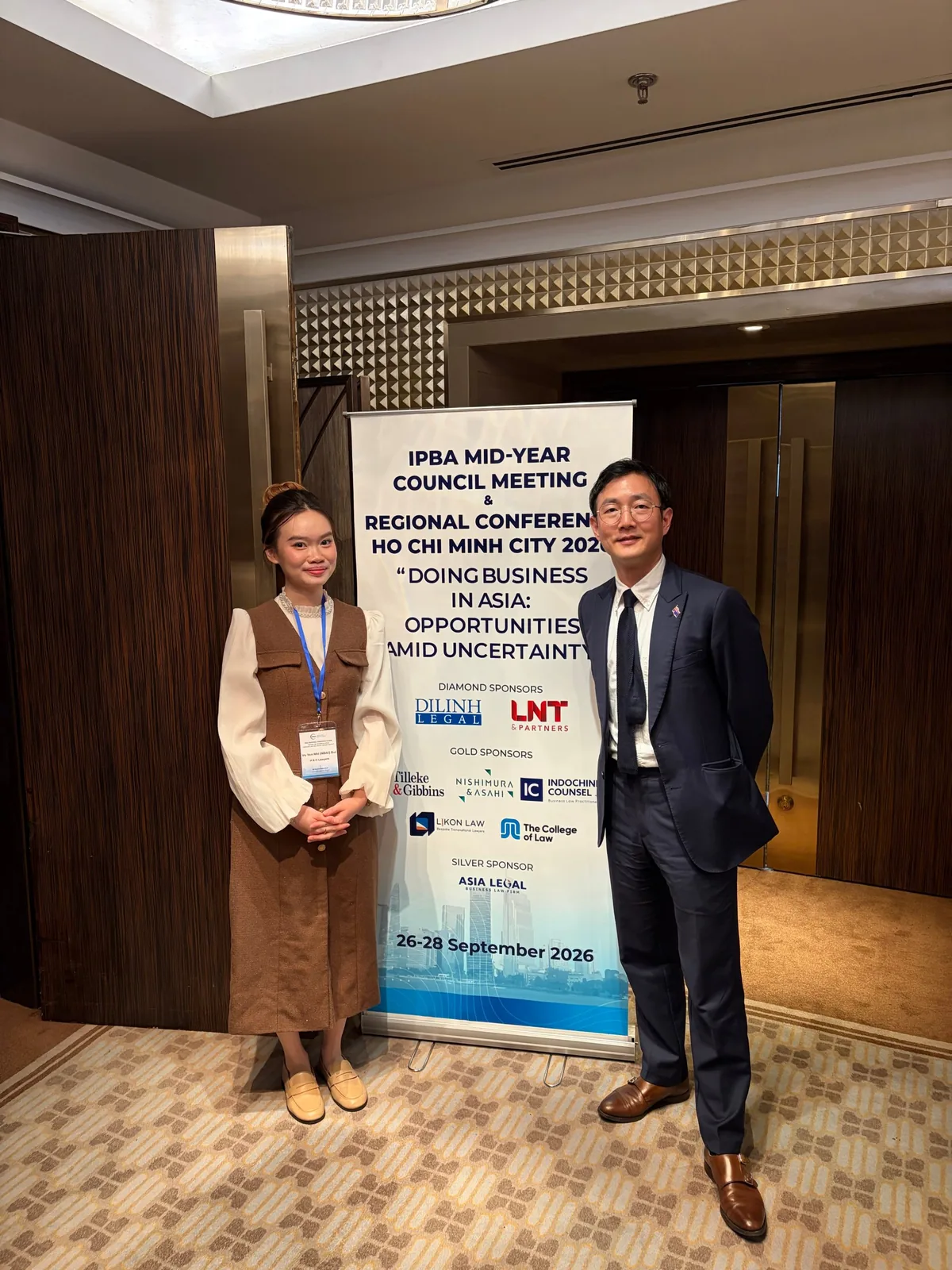 H&H Lawyers at the IPBA Mid-Year Council Meeting and Regional Conference banner in Ho Chi Minh City